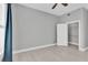 Neutral bedroom featuring a ceiling fan, hardwood floors, and a closet at 1501 Doyle Carlton Dr # 303, Tampa, FL 33602