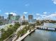Scenic cityscape view featuring modern buildings, a river, and a bridge on a sunny day at 1501 Doyle Carlton Dr # 303, Tampa, FL 33602
