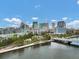 Attractive cityscape showcases modern buildings, a river, walking path, and a bridge on a clear day at 1501 Doyle Carlton Dr # 303, Tampa, FL 33602