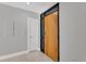 Modern front door with sleek design, side light windows, and neutral wall paint enhances the welcoming ambiance at 1501 Doyle Carlton Dr # 303, Tampa, FL 33602