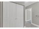 Hallway featuring large closets and gray tiled flooring at 1501 Doyle Carlton Dr # 303, Tampa, FL 33602