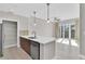 Modern kitchen with stainless steel appliances, quartz counters, and pantry at 1501 Doyle Carlton Dr # 303, Tampa, FL 33602