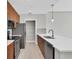 The kitchen has stainless appliances, plenty of cabinets, a pantry and a white quartz countertop at 1501 Doyle Carlton Dr # 303, Tampa, FL 33602