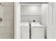A laundry room features a modern washer and dryer setup at 1501 Doyle Carlton Dr # 303, Tampa, FL 33602