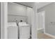 Well-lit laundry area equipped with a modern washer and dryer at 1501 Doyle Carlton Dr # 303, Tampa, FL 33602