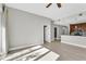 Spacious living room with wood floors open to the kitchen at 1501 Doyle Carlton Dr # 303, Tampa, FL 33602