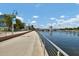 Inviting Riverwalk scene showcases a paved path alongside a waterway and a blue sky with clouds at 1501 Doyle Carlton Dr # 303, Tampa, FL 33602