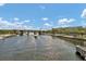 Beautiful waterfront view featuring a bridge, boat, and lush green landscaping at 1501 Doyle Carlton Dr # 303, Tampa, FL 33602