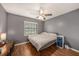 Cozy bedroom featuring a ceiling fan, window, and neutral color scheme, creating a relaxing atmosphere at 15820 Sapwood St, Tampa, FL 33624