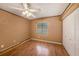 Bedroom featuring wood laminate flooring and double closet at 15820 Sapwood St, Tampa, FL 33624
