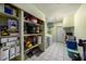 Functional laundry room and storage area with shelving and ample space for organization at 15820 Sapwood St, Tampa, FL 33624