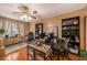Functional office space with hardwood floors, shelving units, and ample desk space at 15820 Sapwood St, Tampa, FL 33624
