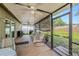 Covered lanai, perfect for enjoying the outdoors in comfort, features ample space for seating and grilling at 15820 Sapwood St, Tampa, FL 33624