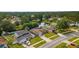 An aerial view of a neighborhood with a tranquil canal running through it at 15917 Crying Wind Dr, Tampa, FL 33624
