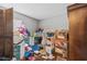 Spacious bedroom cluttered with various items and dark wood floors at 15917 Crying Wind Dr, Tampa, FL 33624