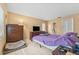 Cozy bedroom with tiled floors, closet, and TV at 15917 Crying Wind Dr, Tampa, FL 33624