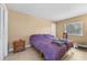 Simple bedroom with a bed, side table, and closet at 15917 Crying Wind Dr, Tampa, FL 33624