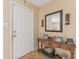 Welcoming foyer featuring a console table, decorative mirror, and neutral paint at 15917 Crying Wind Dr, Tampa, FL 33624