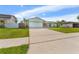 A single-story home showcases a well-maintained front lawn and a spacious driveway at 15917 Crying Wind Dr, Tampa, FL 33624