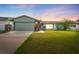Charming single-story home featuring a well-manicured lawn and attached garage at 15917 Crying Wind Dr, Tampa, FL 33624