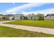A single-story home showcases a well-maintained front lawn and a spacious driveway at 15917 Crying Wind Dr, Tampa, FL 33624