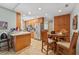 Open-concept kitchen featuring wood cabinets, stainless steel appliances, and an eat-in dining area at 15917 Crying Wind Dr, Tampa, FL 33624