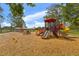 A colorful playground with slides and play equipment is set on a wood chip surface at 15917 Crying Wind Dr, Tampa, FL 33624