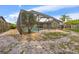 View of caged-in pool from the backyard, surrounded by green foliage at 15917 Crying Wind Dr, Tampa, FL 33624