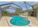 Inviting screened-in pool with ample patio space, perfect for relaxation at 15917 Crying Wind Dr, Tampa, FL 33624