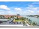 Waterfront neighborhood showcasing lush landscaping, private boat docks, and luxurious homes with red-tile roofs at 1651 Sand Key Estates Ct # 54, Clearwater Beach, FL 33767