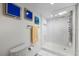 Contemporary bathroom with a glass-enclosed shower, and modern fixtures at 1651 Sand Key Estates Ct # 54, Clearwater Beach, FL 33767