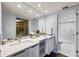 Luxurious bathroom with double vanity, modern fixtures, and a walk-in shower at 1651 Sand Key Estates Ct # 54, Clearwater Beach, FL 33767