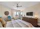 Comfortable bedroom boasts stylish decor, a ceiling fan, and water views at 1651 Sand Key Estates Ct # 54, Clearwater Beach, FL 33767