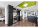 Modern kitchen with stainless steel appliances, sleek cabinetry, and an open view to the living and dining areas at 1651 Sand Key Estates Ct # 54, Clearwater Beach, FL 33767