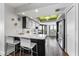 Modern kitchen with sleek cabinets, stainless steel appliances, breakfast bar, and a scenic water view at 1651 Sand Key Estates Ct # 54, Clearwater Beach, FL 33767
