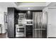 Sleek kitchen featuring modern appliances, stainless steel refrigerator, oven, and microwave at 1651 Sand Key Estates Ct # 54, Clearwater Beach, FL 33767