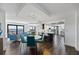 Open concept with dining table, modern lighting, and an adjacent kitchen with water views and modern design at 1651 Sand Key Estates Ct # 54, Clearwater Beach, FL 33767