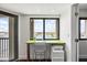 Bright office space with a desk, chair, printer, and a picturesque water view at 1651 Sand Key Estates Ct # 54, Clearwater Beach, FL 33767