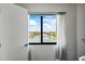 Scenic window view of waterways and waterfront homes under a blue sky at 1651 Sand Key Estates Ct # 54, Clearwater Beach, FL 33767