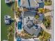 An aerial view of the home showcasing the boat dock, pool, balcony, and beautiful landscaping at 17077 Dolphin Dr, North Redington Beach, FL 33708
