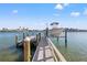 A private boat dock with a boat lift provides access to the open water at 17077 Dolphin Dr, North Redington Beach, FL 33708