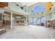 Bright living room with high ceilings, a staircase, and beautiful bay views at 17077 Dolphin Dr, North Redington Beach, FL 33708