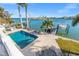 Backyard pool with outdoor seating and a boat dock, plus easy access to the water at 17077 Dolphin Dr, North Redington Beach, FL 33708