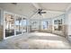 Light-filled sun room with expansive windows and views of the waterfront at 17077 Dolphin Dr, North Redington Beach, FL 33708