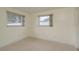 Bedroom featuring neutral walls, carpet flooring, and natural lighting at 2020 Douglas Ave, Dunedin, FL 34698