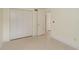 Spacious bedroom with ample closet space, neutral walls and flooring at 2020 Douglas Ave, Dunedin, FL 34698