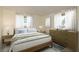 Staged bedroom showcasing natural light, neutral colors, and serene ambiance at 2020 Douglas Ave, Dunedin, FL 34698