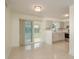 Modern eat-in kitchen area with sliding doors to lanai, stainless appliances, and grey cabinets at 2020 Douglas Ave, Dunedin, FL 34698