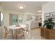 Eat-in kitchen with modern grey cabinets, stainless appliances, and sliding glass doors to lanai at 2020 Douglas Ave, Dunedin, FL 34698