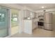 Bright kitchen featuring modern stainless steel appliances and neutral tones at 2020 Douglas Ave, Dunedin, FL 34698